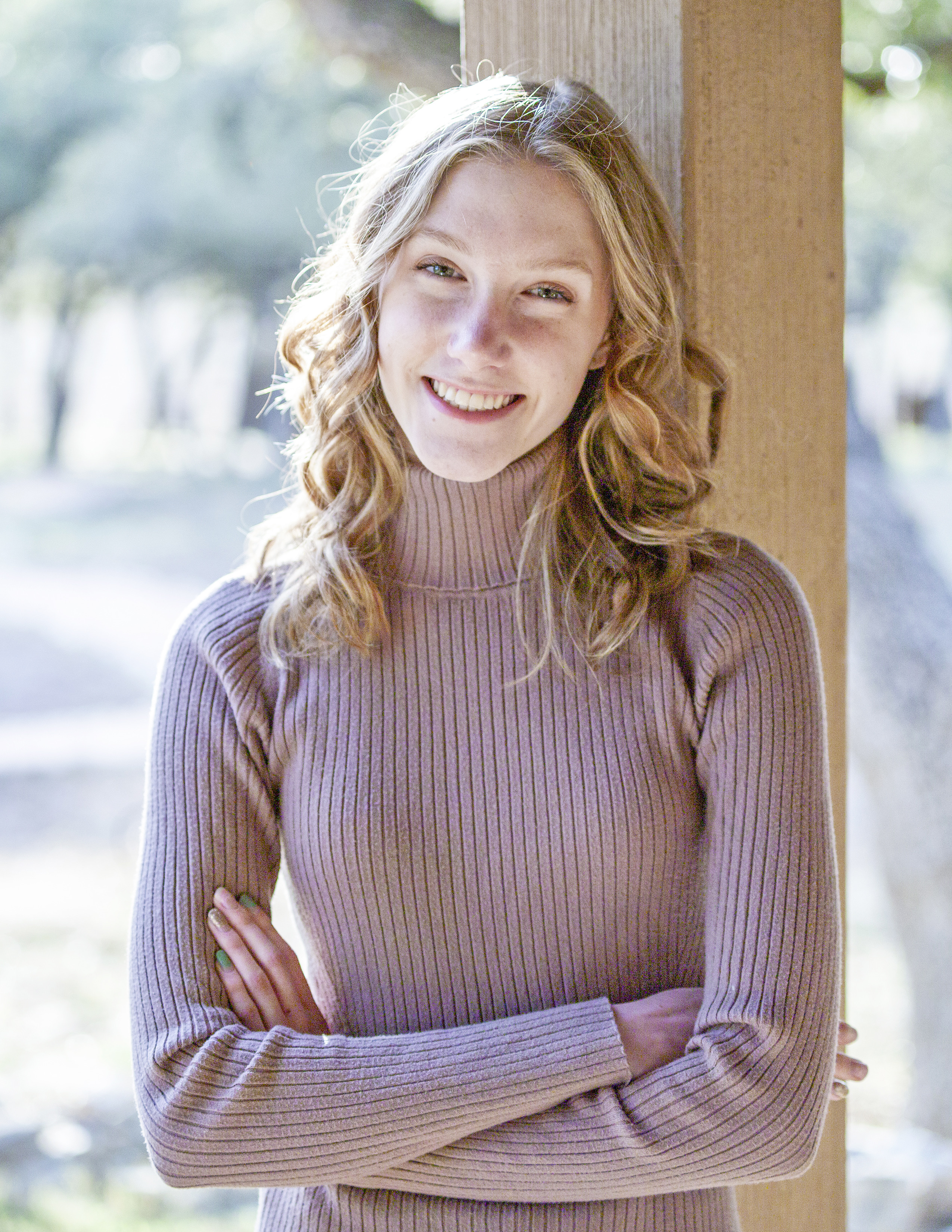 Laurel Snow smiling in a serene outdoor settings. 