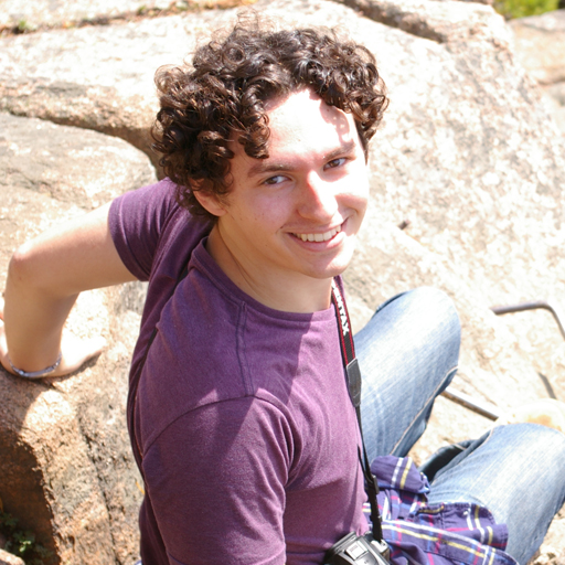 Dr. Vincent S. Riggi smiling outdoors in a casual portrait for the RARE Center.