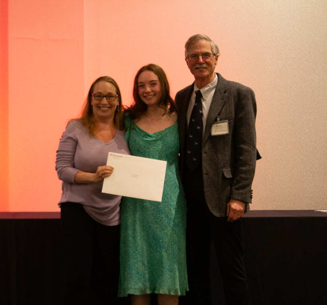 Dr. Karyn Rogers, Clare Heinold, and Dr. Kurt Anderson on stage after presenting Clare with the Peter A Fox award for Excellence in Astrobiology
